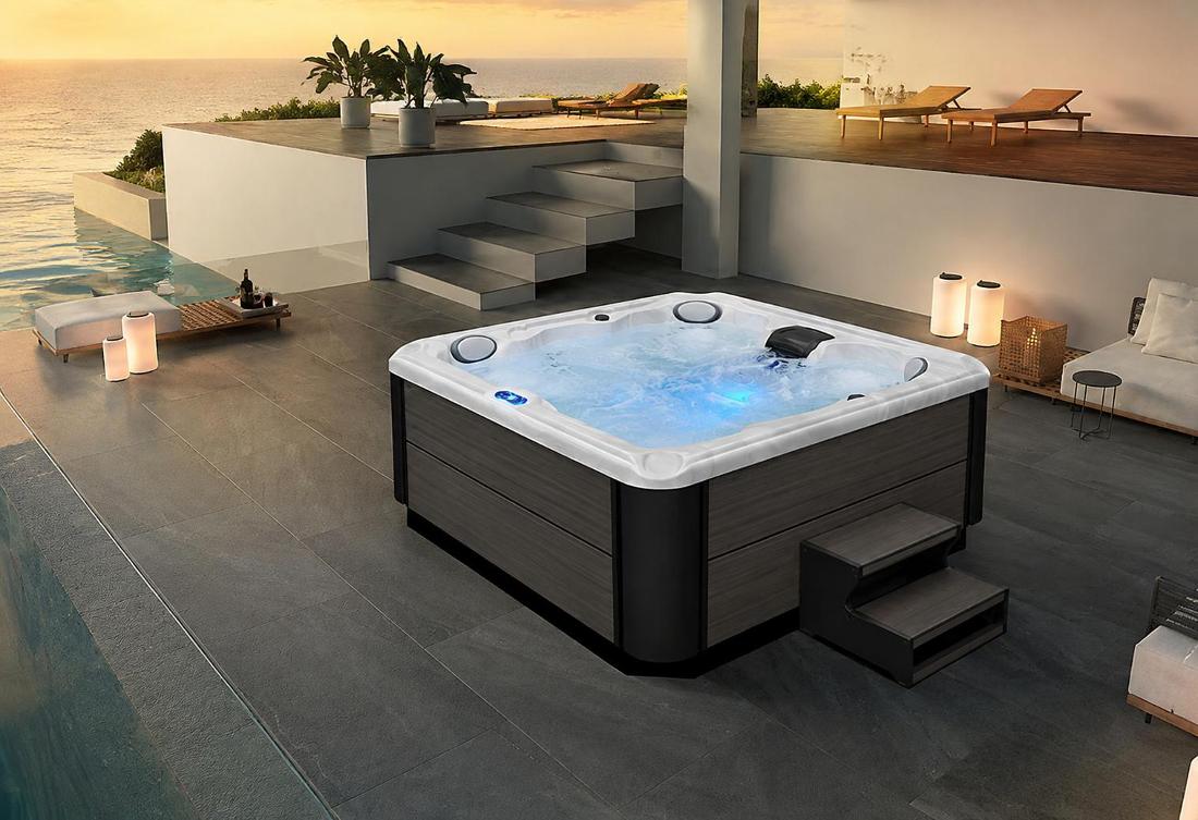 A high-angle 45-degree shot of a square hot tub with soft blue interior LED lighting