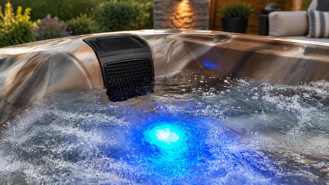 Blue LED lighting glowing from the bottom of the tub through the water
