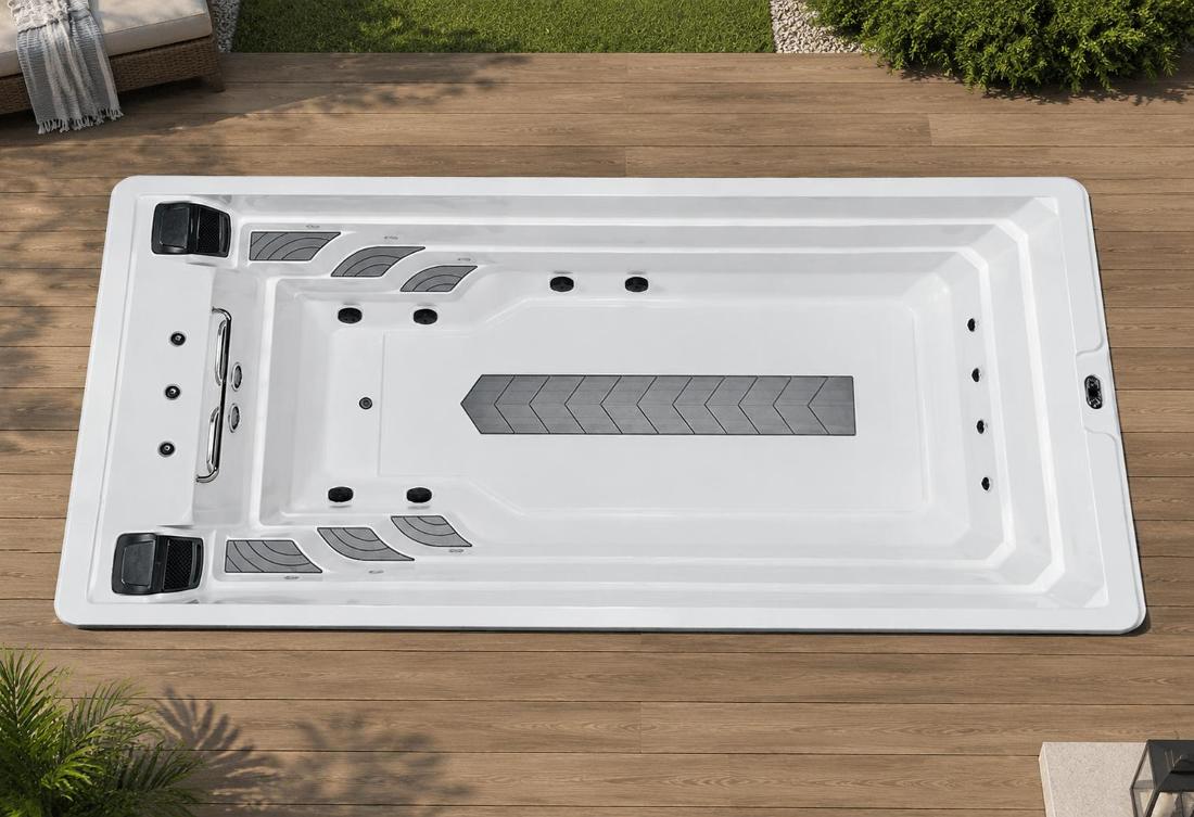 A top-down view of the pool interior showing anti-skid mats and jet layout