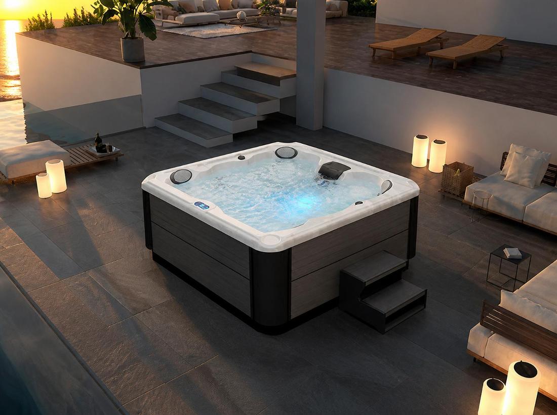 Wide-angle lifestyle shot of the BD-001 hydrotherapy spa on an outdoor stone deck