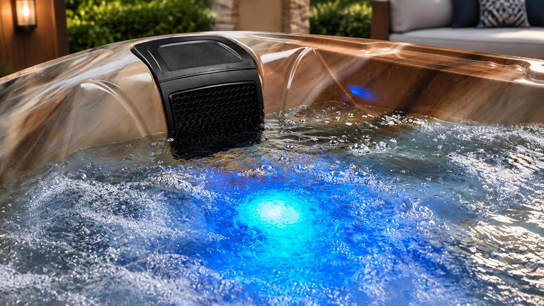 Blue LED lighting glowing softly through water at the base of the spa shell