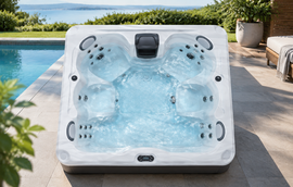 Top-down view of a spa shell showing marbled acrylic finish and molded seating positions