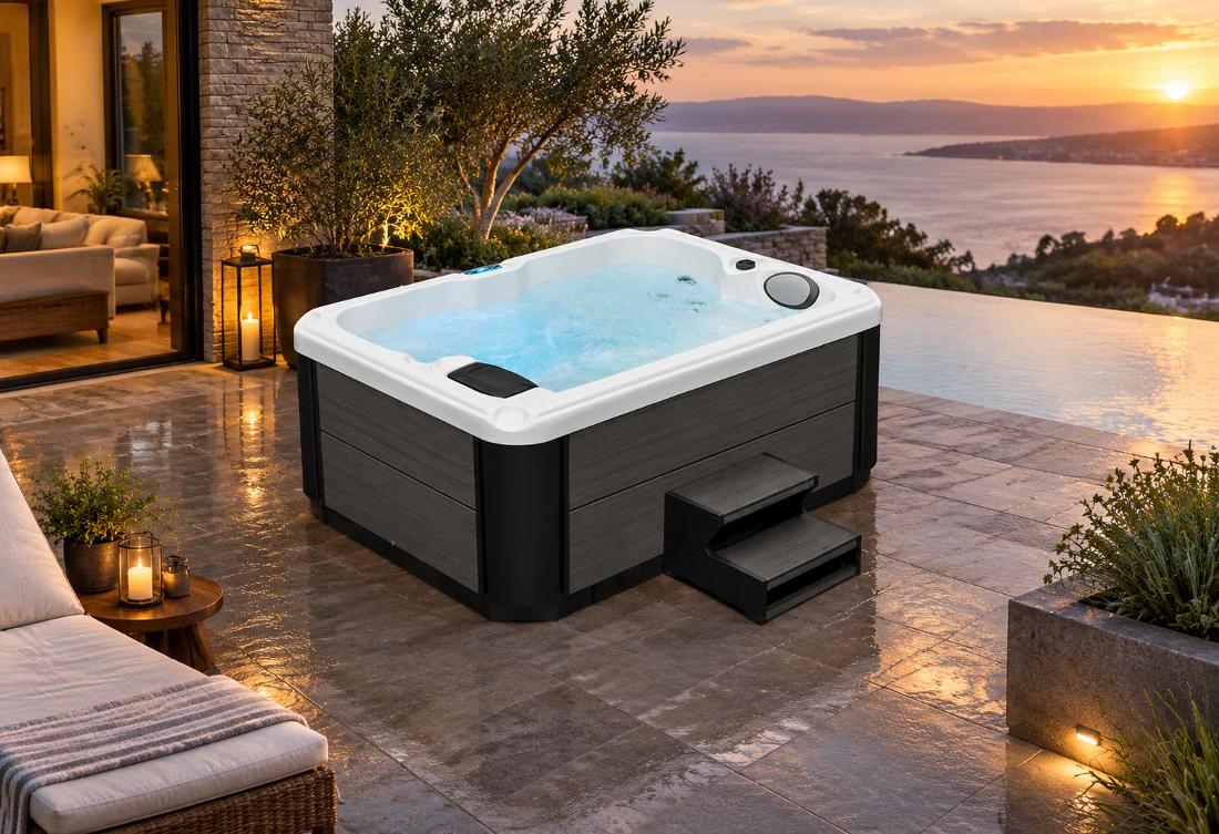 A high-angle 45-degree shot of a rectangular hot tub on a balcony overlooking a city skyline at night