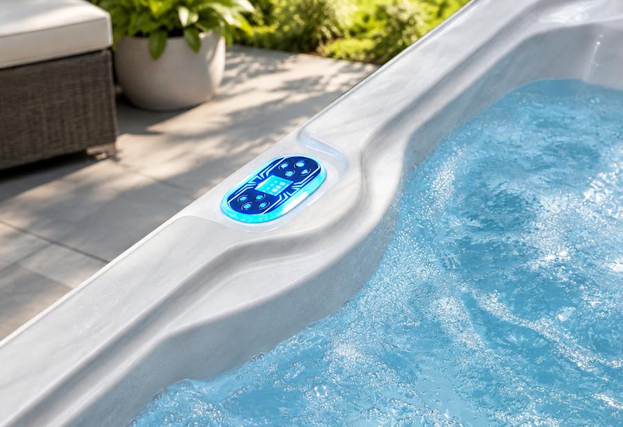 Close-up of the digital control panel mounted on the rim of the tub