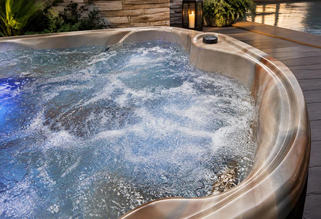 Digital control panel with blue backlighting mounted on the spa rim