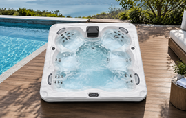 A top-down studio view of a spa shell showing molded seating positions and jet placement